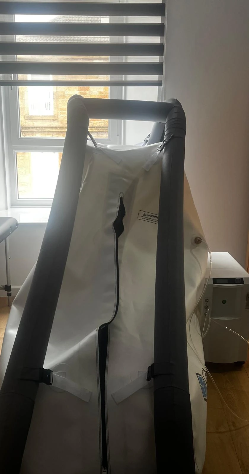 Soft-sided chamber with a long front zip and dark outer frame